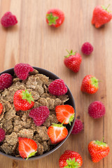 Bran flakes with fresh raspberries and strawberries