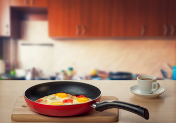 Fried eggs and coffee at the kitchen table