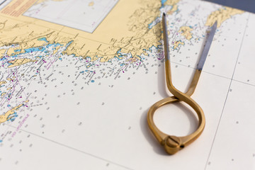 Pair of compasses for navigation on a sea map