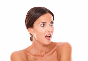 Surprised beautiful woman looking to her left