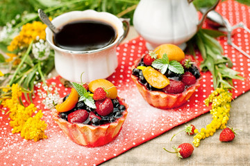 Breakfast with berries cakes and coffee