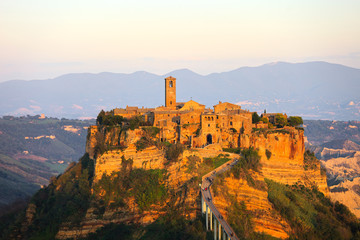 Fototapeta na wymiar Civita di Bagnoregio landmark, aerial panoramic view on sunset.