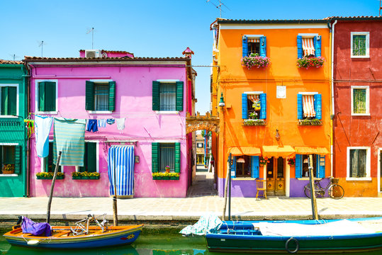 Fototapeta Venice landmark, Burano island canal, colorful houses and boat,