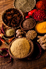 Spices in traditional Asian theme on wooden table