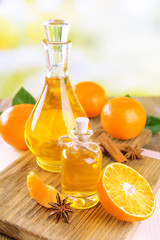 Tangerine oil on table on light background