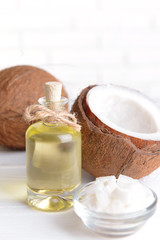 Coconut oil on table on light background