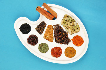 Painting palette with various spices and herbs,