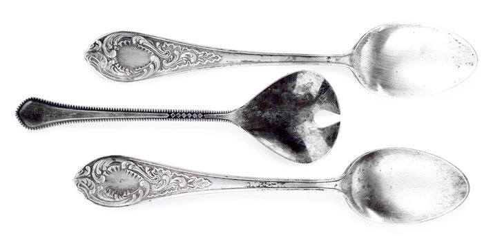 Three tablespoons isolated on white