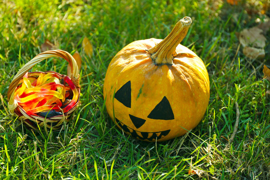 Halloween pumpkin and basket with candies