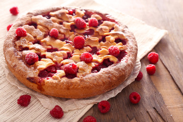 Tasty cake with berries on table close-up