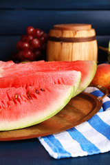 Composition of ripe watermelon, fruits, pink wine in glass and