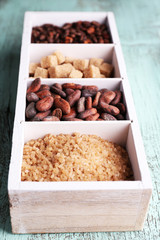 Wooden box with set of coffee and cocoa beans, sugar cubes
