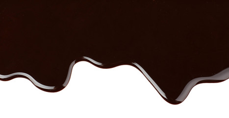Melted chocolate dripping on white background