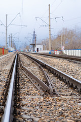 Obraz premium Rails, cross ties, columns, wires