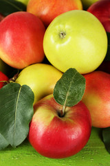Ripe apples on wooden background