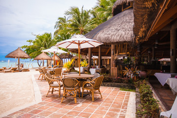 Fototapeta na wymiar Outdoor cafe on tropical beach