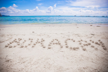 Boracay written in a sandy tropical beach