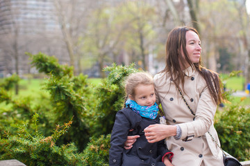 Young mother and her daughter for a walk in Central Park