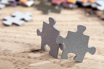 Two jigsaw puzzle pieces on table