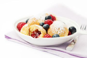Traditional danish pancakes - ebelskivers with fresh berries