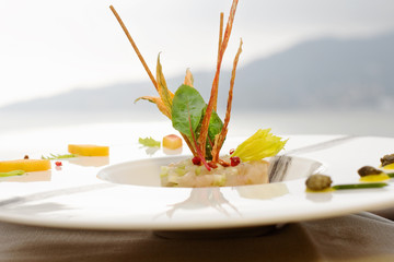 tartare with lampuga fish, celery, and food garnish