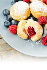 Traditional danish pancakes - ebelskivers with fresh berries