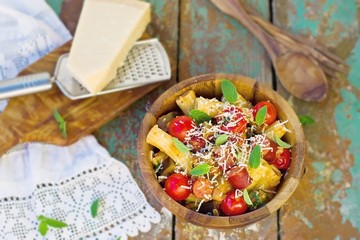 macaroni with vegetables, sausages and parmesan
