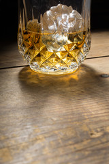 Alcoholic drink in glass with ice