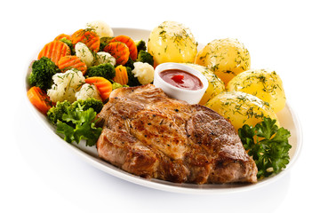 Steak, boiled potatoes and vegetables