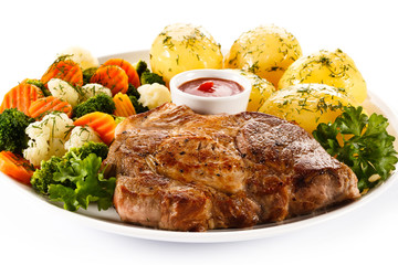 Steak, boiled potatoes and vegetables