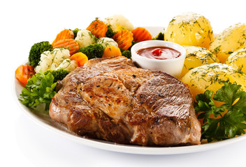 Steak, boiled potatoes and vegetables