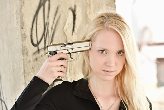 	beautiful sexy girl holding gun