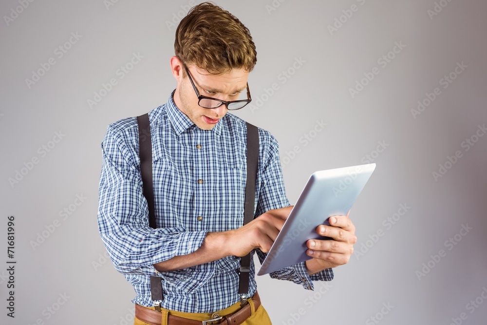 Aufkleber geeky businessman using his tablet pc