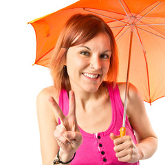 Girl holding an umbrella over white background