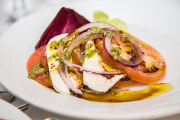 Caprese Salad with Onions and Pesto