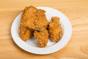 Fried Chicken on Small White Plate and Wood Table