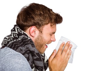 Close up side view of man blowing nose