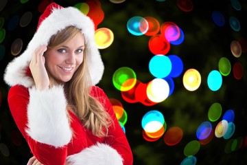 Composite image of festive blonde smiling at camera