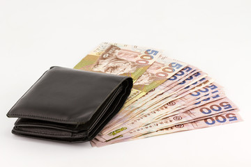 Hong Kong currency and wallet on white background