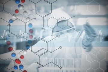 Chemist working cautiously with liquid