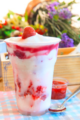 smoothy strawberry milk ready for eating on decoration table top
