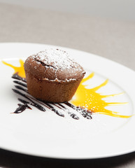 Chocolate soufflé with sun behind up an eggnog and sugar