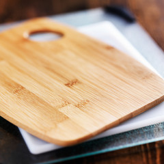 assorted cutting boards in a pile
