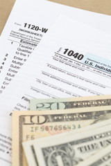U.S. income tax form and dollar bill
