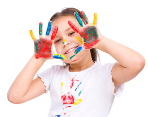 Cute girl playing with paints