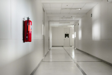 Fire extinguisher in empty corridor