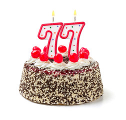Geburtstagstorte mit brennender Kerze Nummer 77