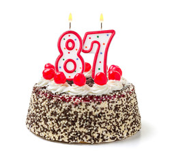 Geburtstagstorte mit brennender Kerze Nummer 87