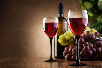 Glasses of red wine and bottle