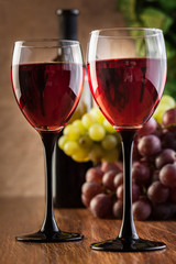 Glasses of red wine and bottle